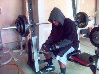A 2007 photo of me on a weight bench with 95 pounds ready to bench press